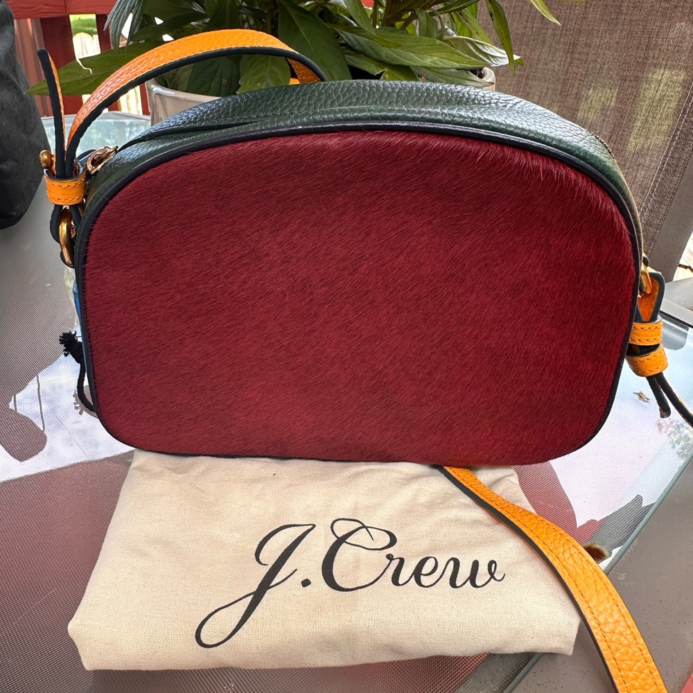Devon J. Crew Crossbody Bag in Red, Green, Blue with a yellow crossbody strap.